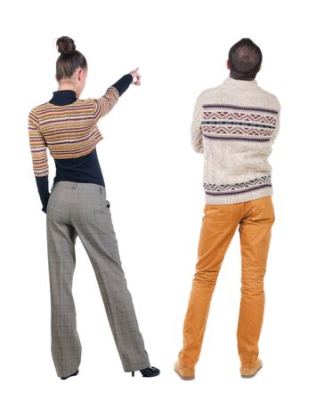 Back view couple with laptop in sweater. beautiful man and woman. Rear view people collection. backside view of person. Isolated over white background.の写真素材