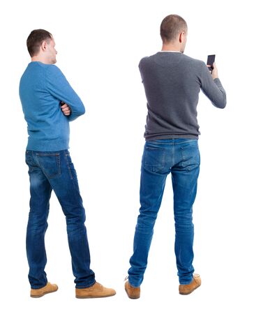back view of two man with shopping bags. backside view of person. Rear view people collection. Isolated over white background.の写真素材