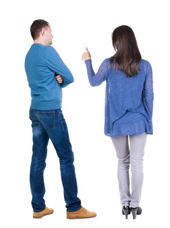 Back view of couple in sweater showing thumbs up. beautiful woman and man together. Rear view people collection. backside view of person. Isolated over white background.の写真素材
