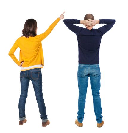 Back view of couple in sweater pointing. Rear view people collection. backside view of person. Isolated over white background.の写真素材