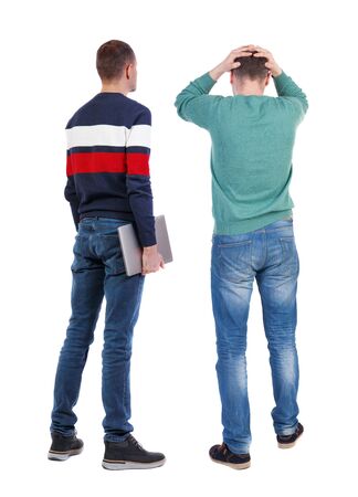Back view two man in sweater with laptop. Rear view people collection. backside view of person. Isolated over white background. Guys looking forwardの写真素材
