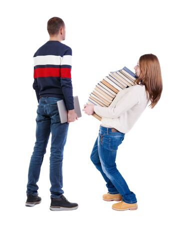 Back view couple with laptop in sweater. beautiful man and woman. Rear view people collection. backside view of person. Isolated over white background.の写真素材
