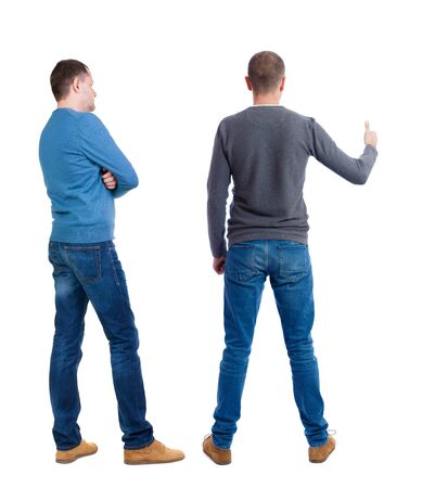 Back view two man in sweater showing thumb up. Rear view people collection. backside view of person. Isolated over white background.の写真素材