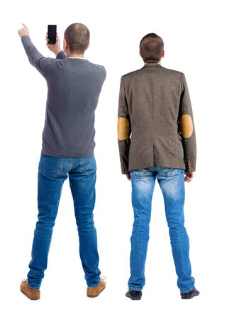 Back view of two man in sweater with mobile phone. Rear view people collection. backside view of person. Isolated over white background.の写真素材