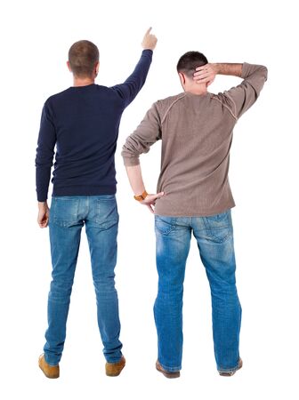 Back view of two man in sweater pointing. Rear view people collection. backside view of person. Isolated over white background. Guys stare aheadの写真素材