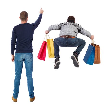 back view of two man with shopping bags. backside view of person. Rear view people collection. Isolated over white background.の写真素材