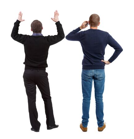 Back view of two man in sweater with mobile phone. Rear view people collection. backside view of person. Isolated over white background.の写真素材