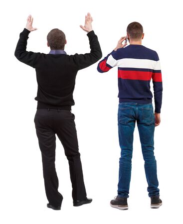 Back view of two man in sweater with mobile phone. Rear view people collection. backside view of person. Isolated over white background.の写真素材