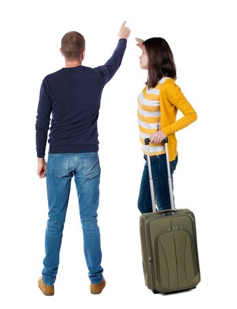 young couple in sweater traveling with suitcas. Back view. Rear view people collection. backside view of person. Isolated over white background.の写真素材