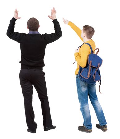 Back view of two man in sweater pointing. Rear view people collection. backside view of person. Isolated over white background. Guys stare aheadの写真素材