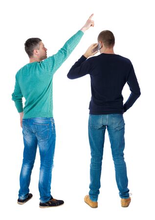Back view of two man in sweater with mobile phone. Rear view people collection. backside view of person. Isolated over white background.の写真素材