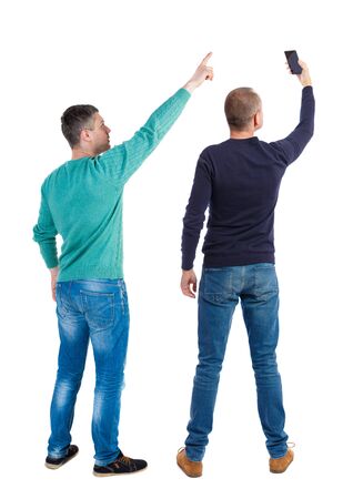 Back view of two man in sweater with mobile phone. Rear view people collection. backside view of person. Isolated over white background.の写真素材
