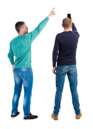 Back view of two man in sweater with mobile phone. Rear view people collection. backside view of person. Isolated over white background.の写真素材