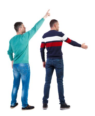 Back view of two man in sweater pointing. Rear view people collection. backside view of person. Isolated over white background. Guys stare aheadの写真素材