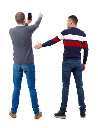 Back view of two man in sweater with mobile phone. Rear view people collection. backside view of person. Isolated over white background.の写真素材