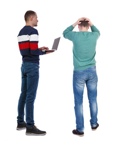 Back view two man in sweater with laptop. Rear view people collection. backside view of person. Isolated over white background. Guys looking forwardの写真素材