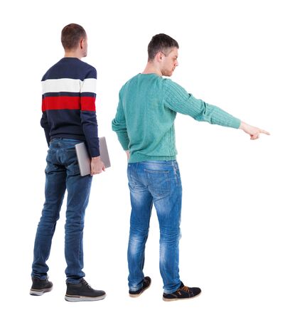Back view two man in sweater with laptop. Rear view people collection. backside view of person. Isolated over white background. Guys looking forwardの写真素材