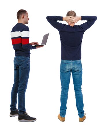 Back view two man in sweater with laptop. Rear view people collection. backside view of person. Isolated over white background. Guys looking forwardの写真素材