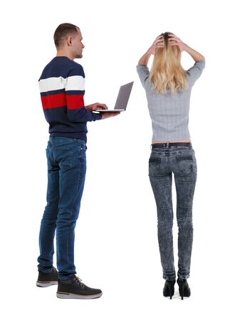 Back view couple with laptop in sweater. beautiful man and woman. Rear view people collection. backside view of person. Isolated over white background.の写真素材