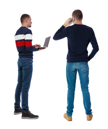 Back view two man in sweater with laptop. Rear view people collection. backside view of person. Isolated over white background. Guys looking forwardの写真素材