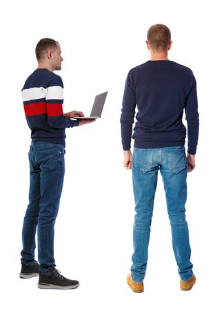 Back view two man in sweater with laptop. Rear view people collection. backside view of person. Isolated over white background. Guys looking forwardの写真素材