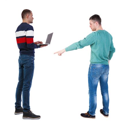 Back view two man in sweater with laptop. Rear view people collection. backside view of person. Isolated over white background. Guys looking forwardの写真素材