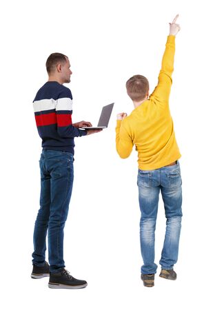 Back view two man in sweater with laptop. Rear view people collection. backside view of person. Isolated over white background. Guys looking forwardの写真素材