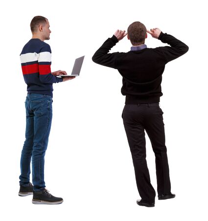 Back view two man in sweater with laptop. Rear view people collection. backside view of person. Isolated over white background. Guys looking forwardの写真素材