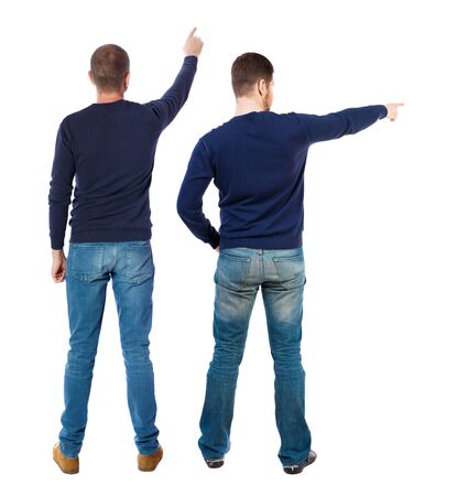 Back view of two man in sweater pointing. Rear view people collection. backside view of person. Isolated over white background. Guys stare aheadの写真素材