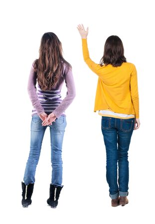 Back view of two woman in sweater. Rear view people collection. backside view of person. Isolated over white background.の写真素材