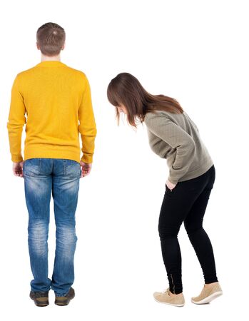 Back view couple in sweater. beautiful man and woman. Rear view people collection. backside view of person. Isolated over white background.の写真素材