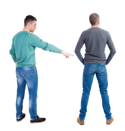Back view of two man in sweater pointing. Rear view people collection. backside view of person. Isolated over white background. Guys stare aheadの写真素材