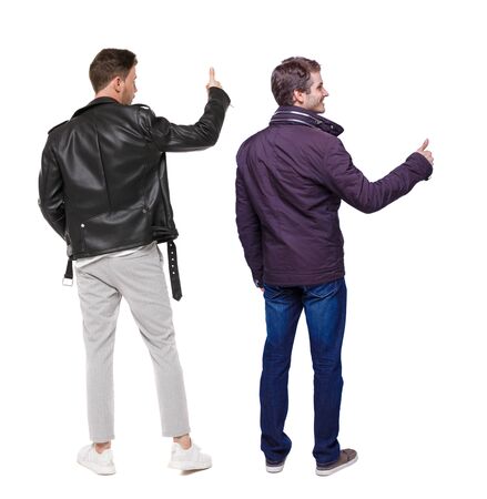 Back view of two man in winter jacket showing thumb up. Rear view people collection. backside view of person. Isolated over white background.の写真素材