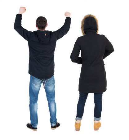Back view of couple in winter jacket. beautiful friendly girl and guy together. Rear view people collection. backside view of person. Isolated over white background.の写真素材