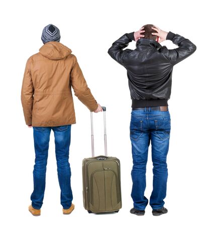 Back view of two man in winter jacket traveling with suitcas. Back view. Rear view people collection. backside view of person. Isolated over white background.の写真素材