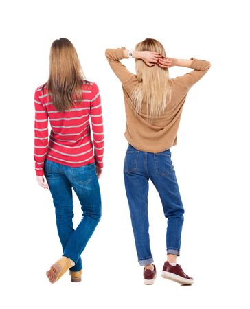 Back view of two woman in sweater. Rear view people collection. backside view of person. Isolated over white background. Girls are looking forwardの写真素材