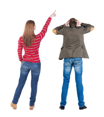 Back view of couple in sweater pointing. Rear view people collection. backside view of person. Isolated over white background.の写真素材