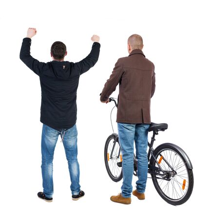 Back view of two man on a bicycle in winter jacket. Rear view people collection. backside view of person. Isolated over white background.の写真素材