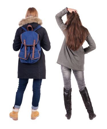 Back view of couple couple in winter jackets pointing. beautiful friendly girl and guy together. Rear view people collection. backside view of person. Isolated over white background.の写真素材