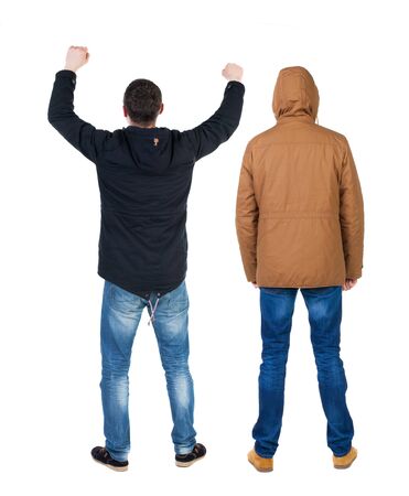 Back view of couple in winter jacket. beautiful friendly girl and guy together. Rear view people collection. backside view of person. Isolated over white background.の写真素材