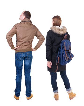 Back view of couple in winter jacket. beautiful friendly girl and guy together. Rear view people collection. backside view of person. Isolated over white background.の写真素材
