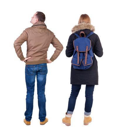 Back view of couple in winter jacket. beautiful friendly girl and guy together. Rear view people collection. backside view of person. Isolated over white background.の写真素材