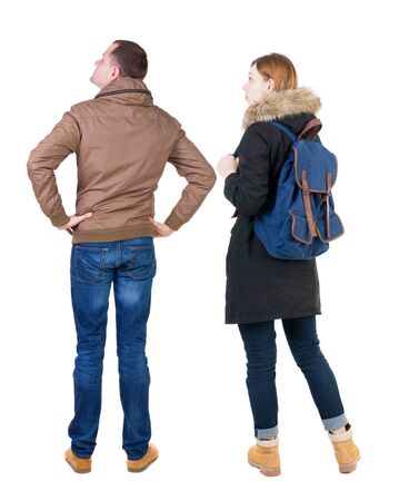 Back view of couple in winter jacket. beautiful friendly girl and guy together. Rear view people collection. backside view of person. Isolated over white background.の写真素材
