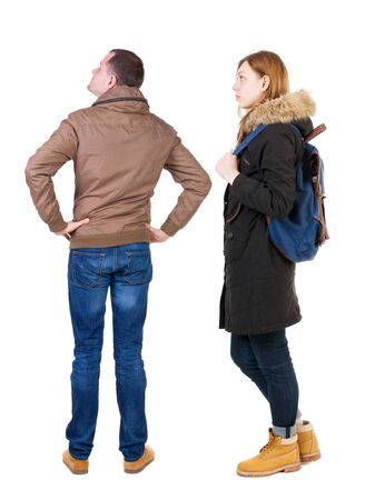 Back view of couple in winter jacket. beautiful friendly girl and guy together. Rear view people collection. backside view of person. Isolated over white background.の写真素材