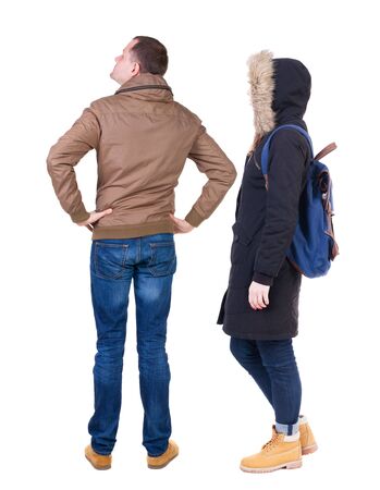 Back view of couple in winter jacket. beautiful friendly girl and guy together. Rear view people collection. backside view of person. Isolated over white background.の写真素材