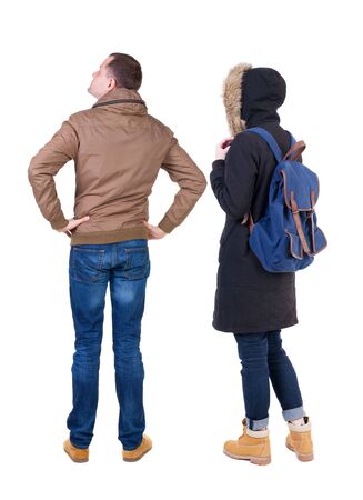 Back view of couple in winter jacket. beautiful friendly girl and guy together. Rear view people collection. backside view of person. Isolated over white background.の写真素材