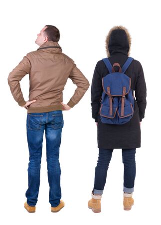 Back view of couple in winter jacket. beautiful friendly girl and guy together. Rear view people collection. backside view of person. Isolated over white background.の写真素材