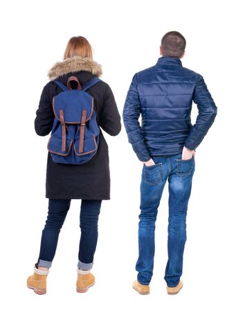 Back view of couple in winter jacket. beautiful friendly girl and guy together. Rear view people collection. backside view of person. Isolated over white background.の写真素材