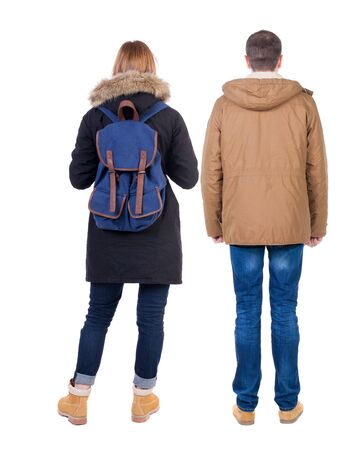 Back view of couple in winter jacket. beautiful friendly girl and guy together. Rear view people collection. backside view of person. Isolated over white background.の写真素材