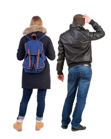 Back view of couple in winter jacket. beautiful friendly girl and guy together. Rear view people collection. backside view of person. Isolated over white background.の写真素材
